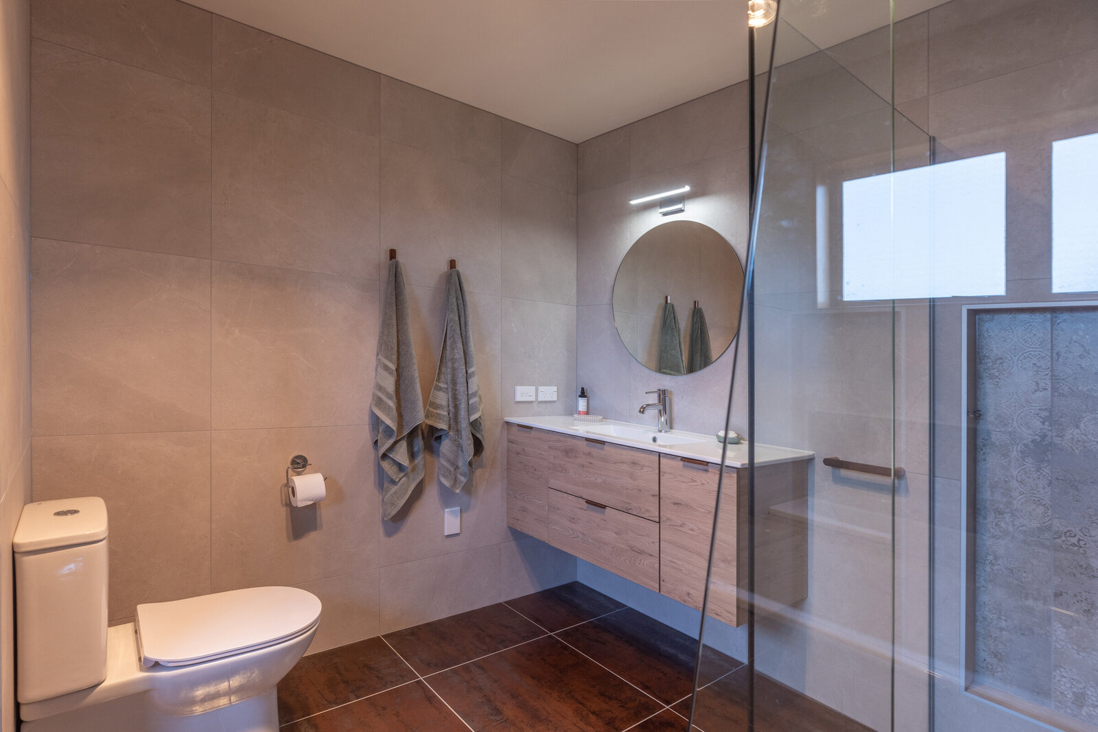 Modern bathroom renovation in Hawke's Bay with custom vanity and tiled shower
